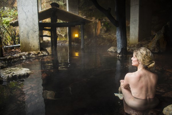 Woman enyoing the hot waters of the Kurokawa onsen