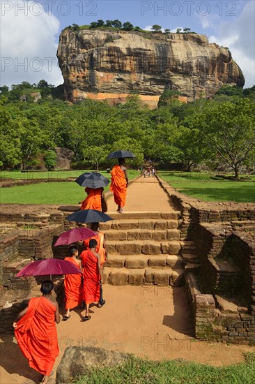 Buddhist monks on their way to the Lion Rock