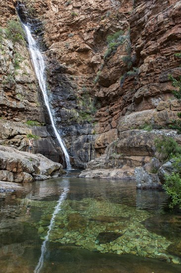 High waterfall falling down a cliff