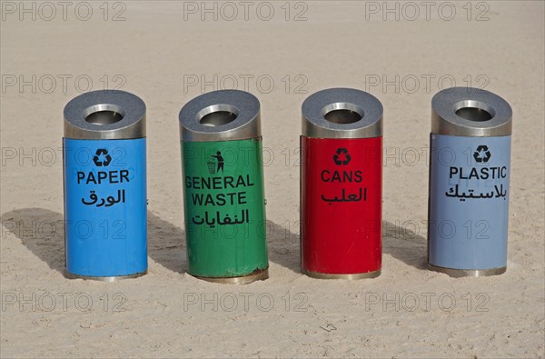 Rubbish bins for sorting waste on the beach at Corniche Road