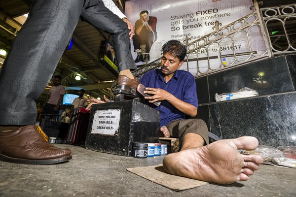 Shoeshine working inside Churchgate Railway Station