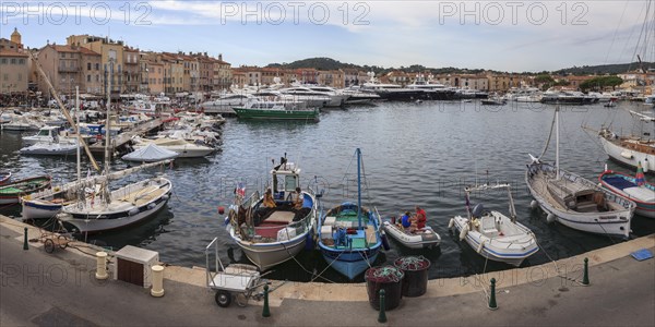 Luxury yachts and fishing boats in the port of Saint-Tropez