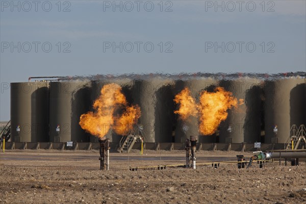 Natural gas is flared off as oil is pumped in the Bakken shale formation