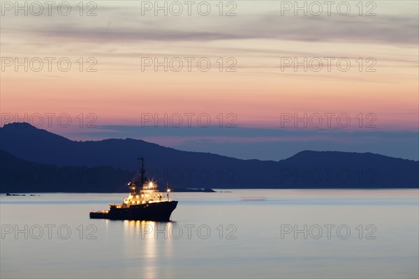 Boat at sunset on the Gulf of Saint-Florent