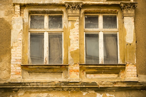 Window of a closed down hotel in need of refurbishment