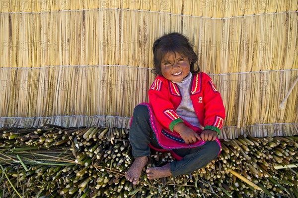 Smiling young girl the Uro Indians