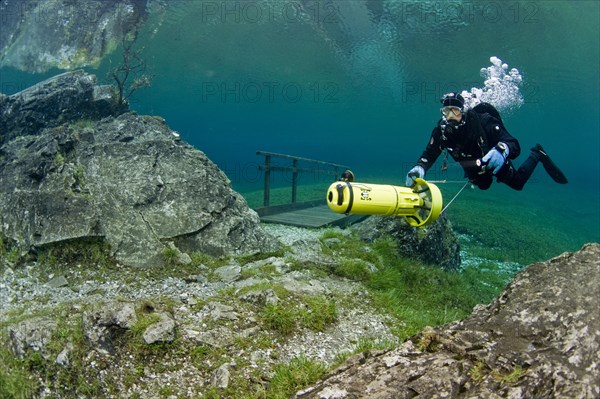 Scuba diver with a scooter