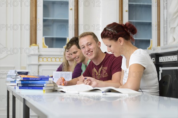 Students studying in the departmental library of the University of Hohenheim in Schloss Hohenheim Palace