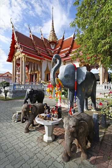 Statues of an elephants decorated with flowers