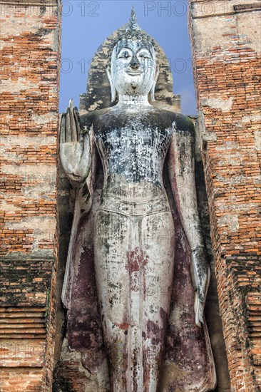 Buddha statue at the ruins of Wat Phra Si Rattana Mahathat temple complex