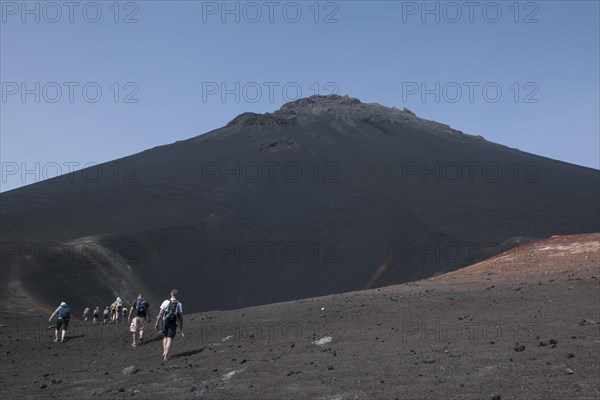 Hikers in the volcanic landscapes of the volcano Pico do Fogo