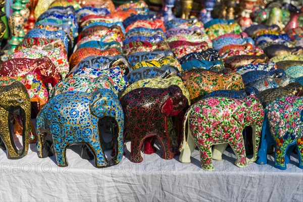 Colourful papier mache elephants for sale at the weekly flea market