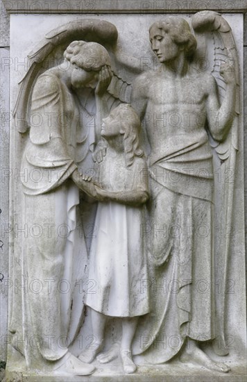 Angel with a mother and child on a gravestone