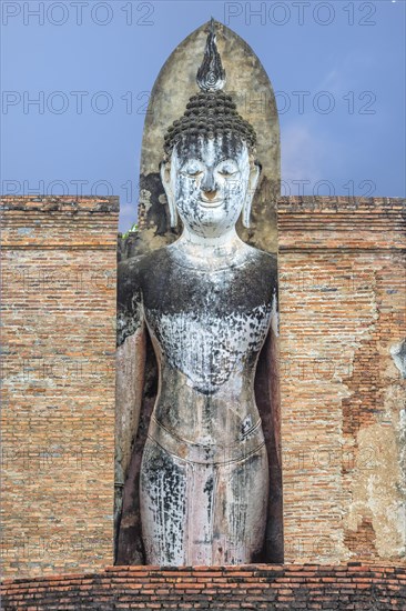 Buddha statue at the ruins of Wat Phra Si Rattana Mahathat temple complex