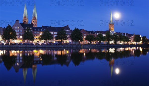 Trave river and the historic centre at full moon