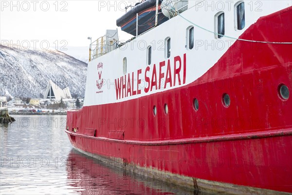Winter in the harbour of Tromso with ship