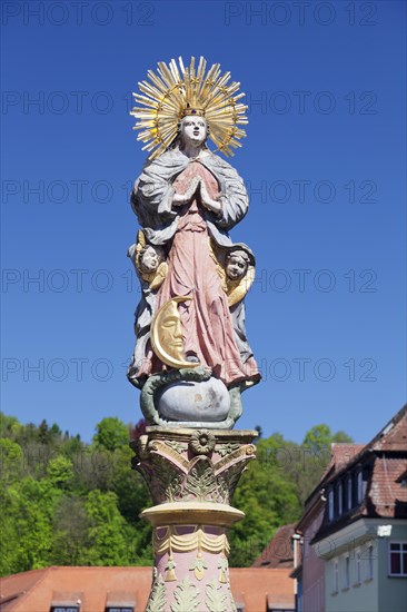 Madonna with a crescent moon on the Marienbrunnen fountain on Marktplatz square