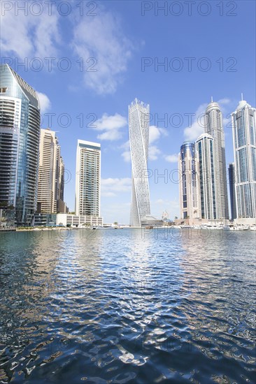 Cayan Tower and skyscrapers with marina