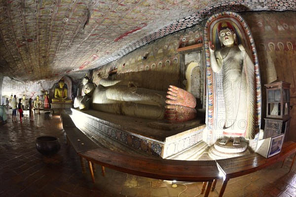 Buddha statues and murals in one of the cave temples of the Golden Temple