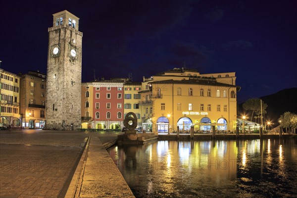 Torre Apponale tower and Lake Garda by night