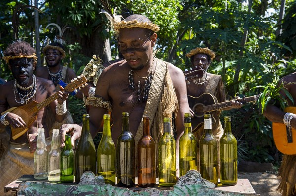 Group of traditional dressed men playing music