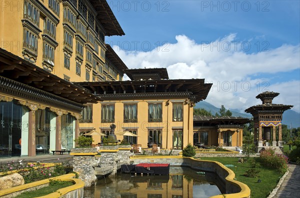 Gardens with a prayer wheel at the Taj Tashi Hotel