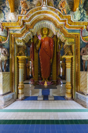 Statue in the old Buddhist temple complex of Sri Pushparama Maha Viharaya