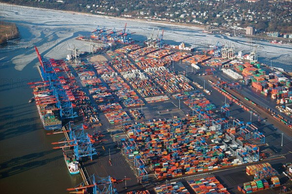 HHLA Container Terminal Burchardkai in winter with ice on the Elbe