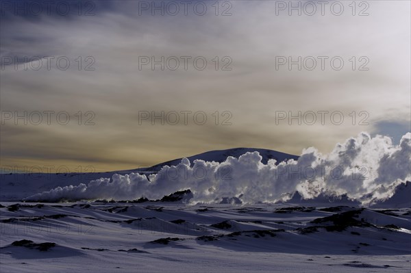 Geyser in a snow-covered landscape