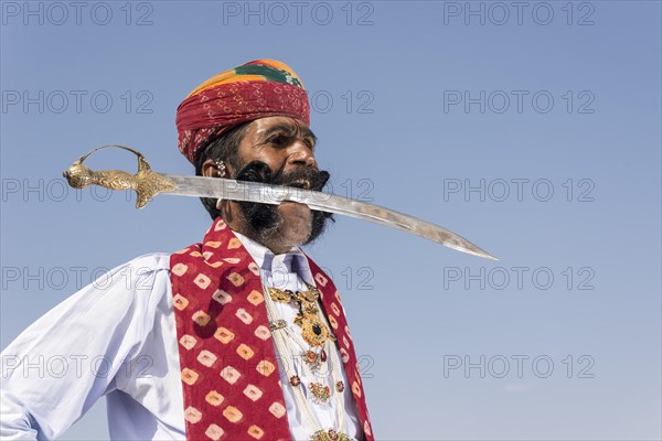 Local man posing with a sword in his mouth