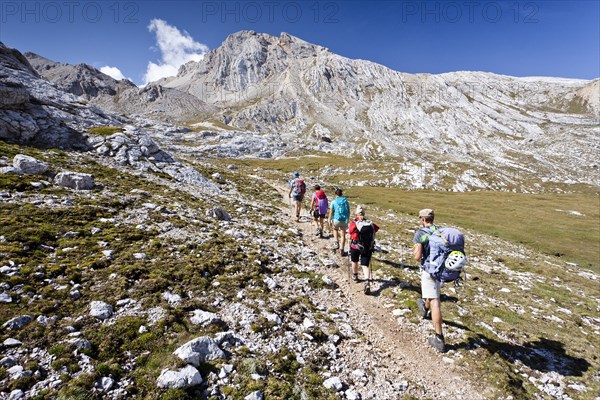 Mountain climbers ascending Lavarela Massif