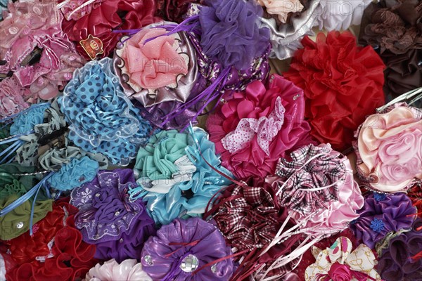 Colourful hair clips in a shop in the Muttrah Souq market