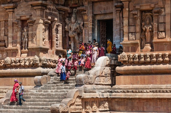 Devout Hindus and children descending a staircase