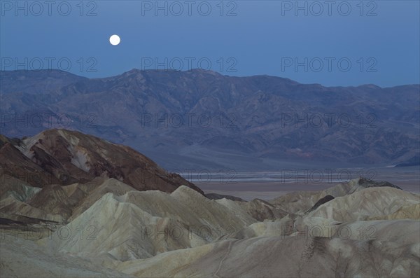 Full moon over the Panamint Range and the Death Valley at dawn