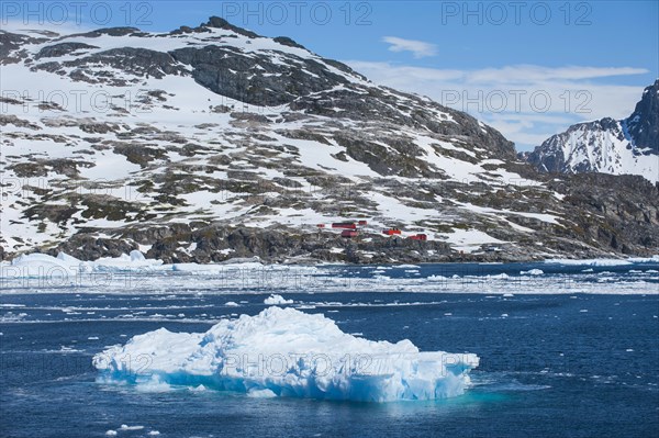 Icebergs with a research station at the back