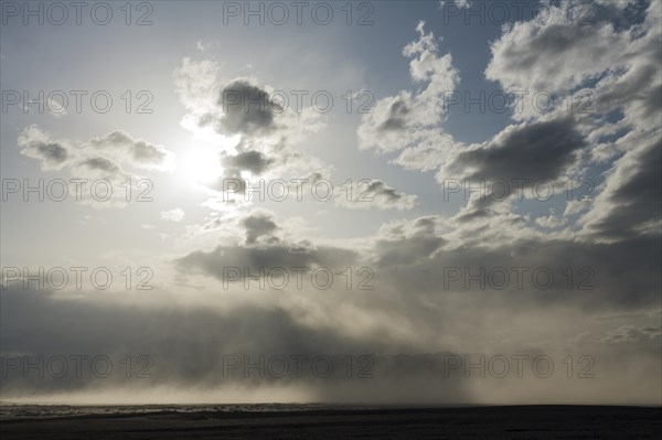 A sand storm over the Mesquite Flat Sand Dunes and the Panamint Range in the evening