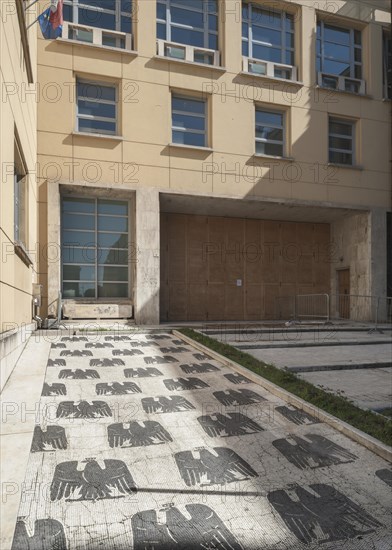 Entrance to a school with a marble mosaic