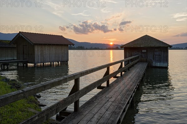 Boathouses at sunset on Lake Kochel