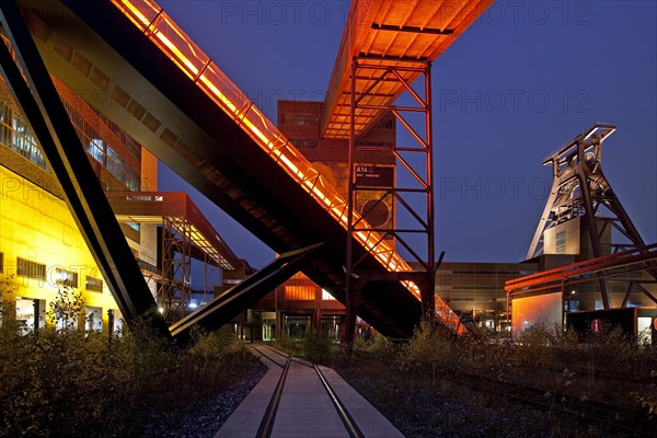 Illuminated gangway to the Ruhr Museum at the Zeche Zollverein Coal Mine Shaft XII with the headframe