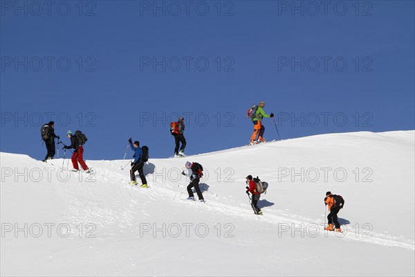 Ski touring group in the ascent to the Piz Arina