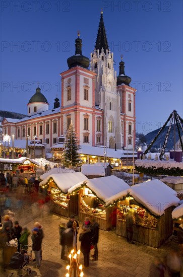 Christmas market in front of the Mariazell Basilica at the blue hour