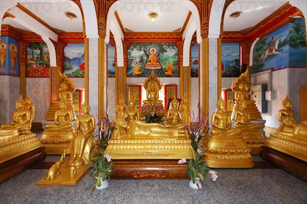 Gilded Buddha statues and reclining Buddhas