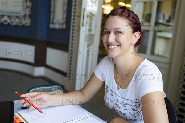 Student studying in the departmental library of the University of Hohenheim in Schloss Hohenheim Palace