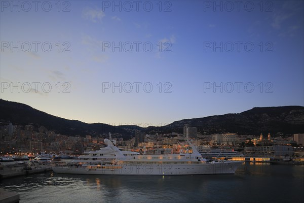 Motor yacht Atlantis II in the evening in Port Hercule