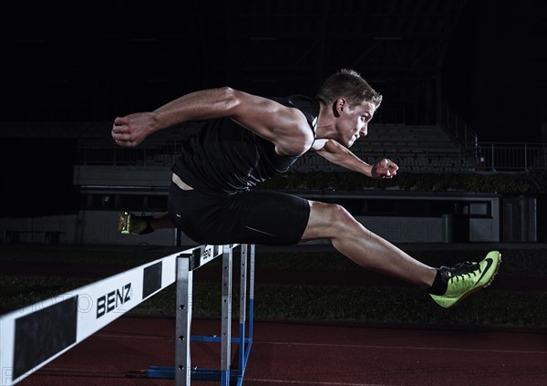 Hurdle racing athlete