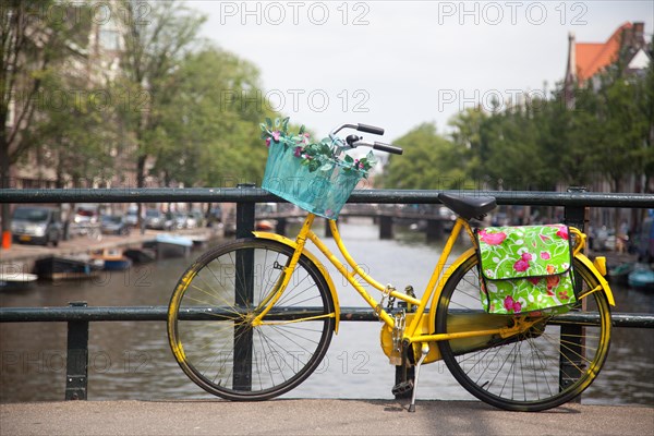 Colourful bicycle parked on a bridge