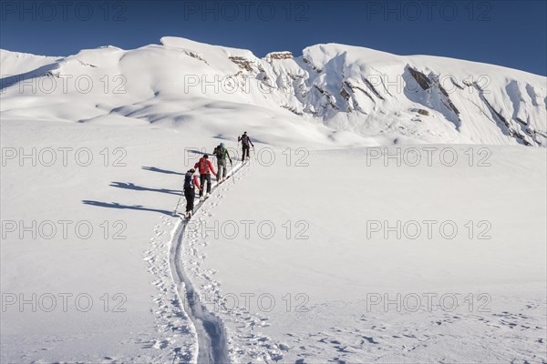 Ski tourers climbing Seekofel mountain