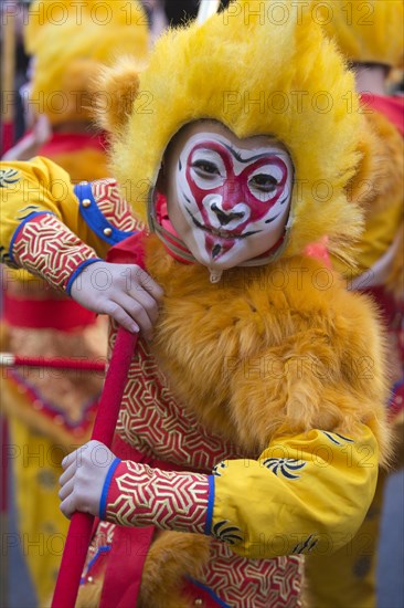 Boy dressed as a yellow monkey