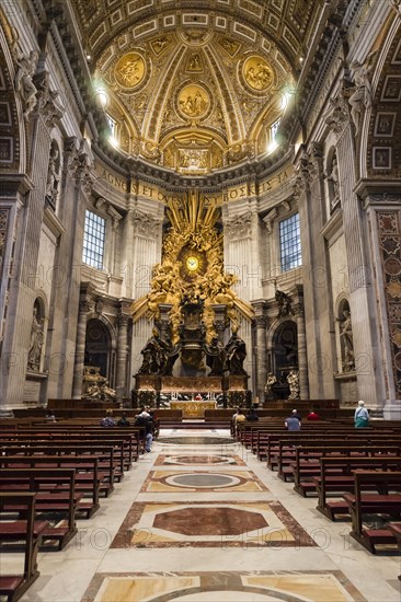 Worshippers in the choir in front of the Cathedra Petri by Bernini