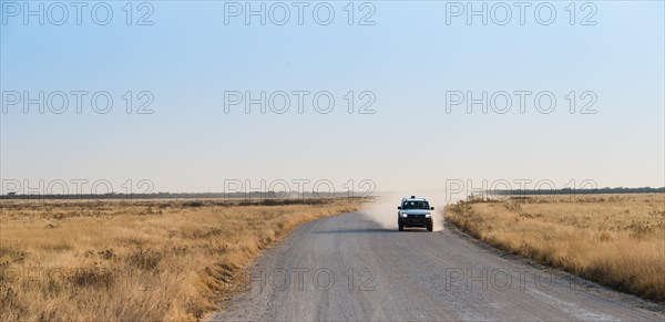 Car travelling on a dirt road